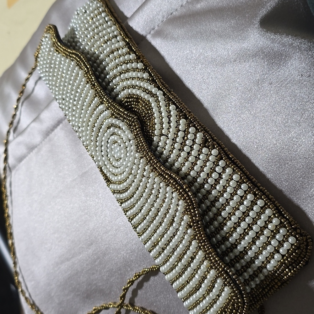 Women shoulder purse long, unique statements beaded gorgeous gold and white bag.